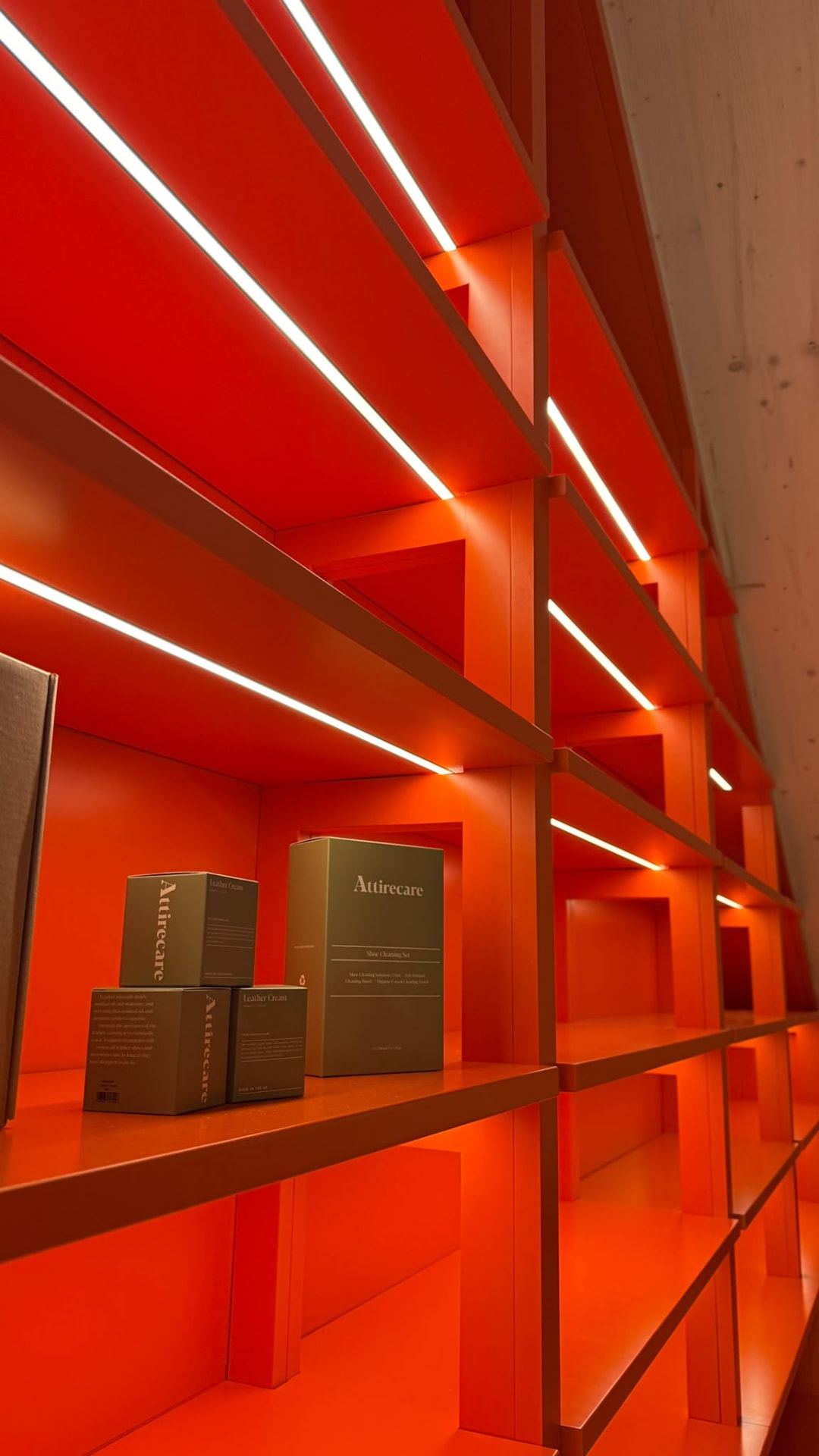 Illuminated red retail display shelving manufactured and fitted for a commercial client